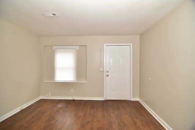 entrance foyer with dark hardwood / wood-style floors