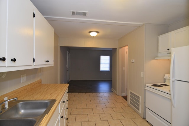 kitchen featuring white appliances, tasteful backsplash, white cabinetry, and sink