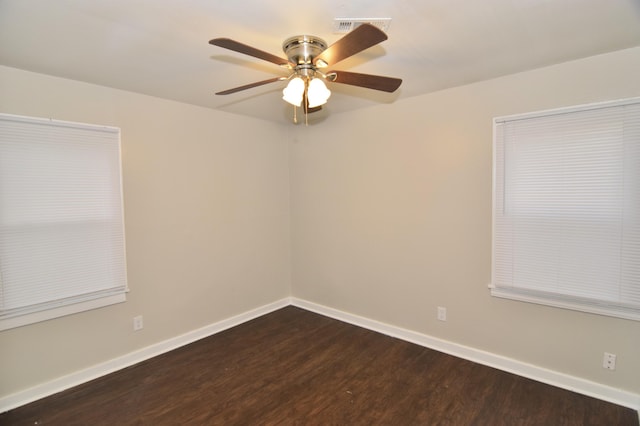 empty room with ceiling fan and hardwood / wood-style flooring