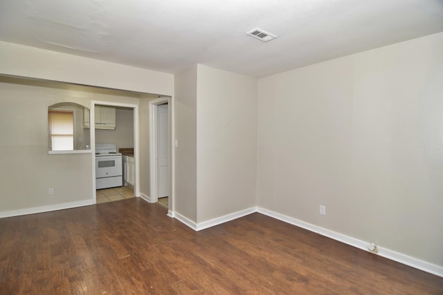 empty room with wood-type flooring