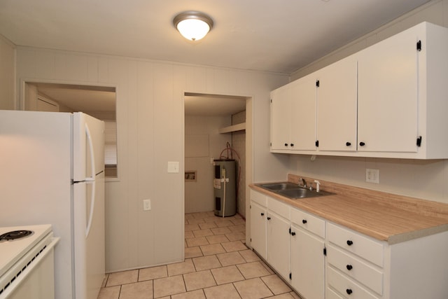 kitchen featuring white cabinetry, electric water heater, and sink