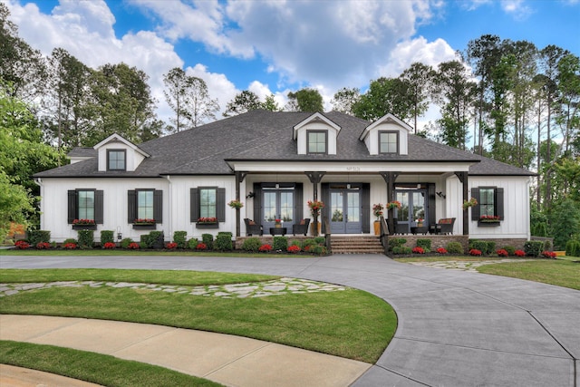 3121 Carillon Way, Evans, GA 30809 - modern farmhouse featuring french doors, board and batten siding, a front yard, roof with shingles, and a porch
