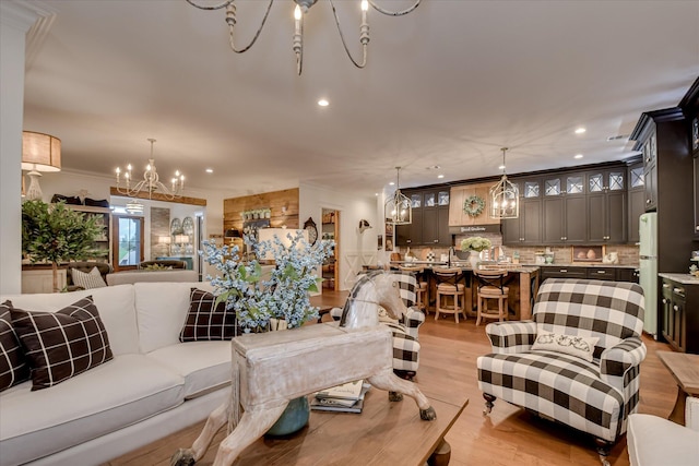 3121 Carillon Way, Evans, GA 30809 - living area featuring a chandelier, light wood finished floors, recessed lighting, and crown molding