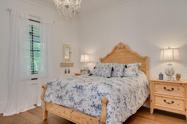 3121 Carillon Way, Evans, GA 30809 - bedroom with wood finished floors, a chandelier, and ornamental molding