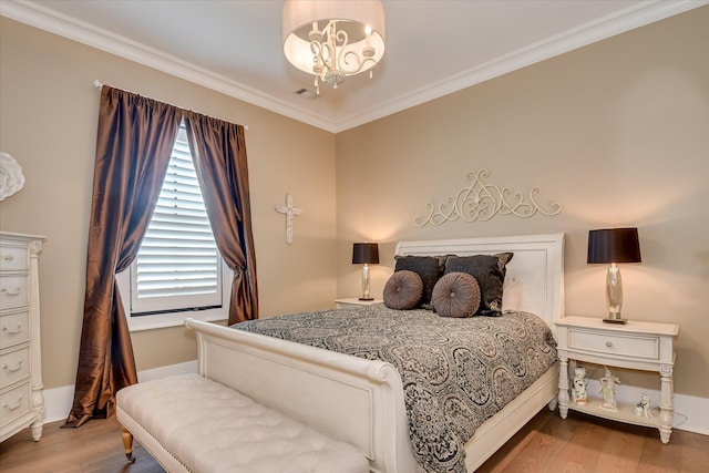 3121 Carillon Way, Evans, GA 30809 - bedroom with wood finished floors, a chandelier, crown molding, and baseboards