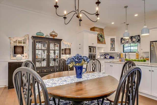 3121 Carillon Way, Evans, GA 30809 - dining space featuring ornamental molding, a chandelier, recessed lighting, and light wood-style flooring