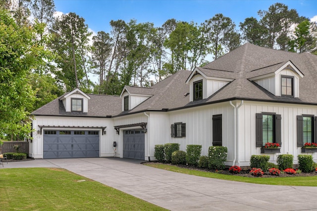3121 Carillon Way, Evans, GA 30809 - modern farmhouse style home featuring driveway, an attached garage, a shingled roof, and a front yard