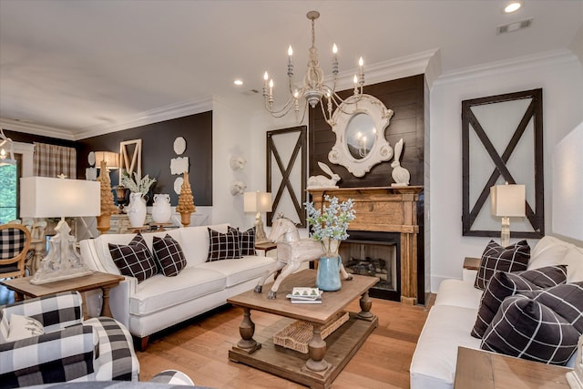 3121 Carillon Way, Evans, GA 30809 - living area with wood finished floors, crown molding, a chandelier, a fireplace, and recessed lighting