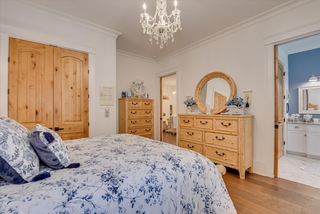 3121 Carillon Way, Evans, GA 30809 - bedroom featuring light wood-style flooring, ornamental molding, a chandelier, and connected bathroom