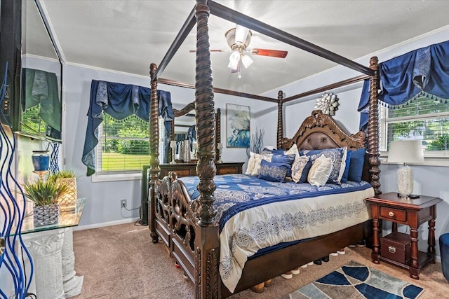 carpeted bedroom featuring crown molding, multiple windows, and baseboards