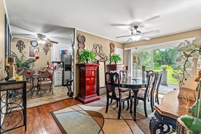 dining room featuring ceiling fan and hardwood / wood-style floors