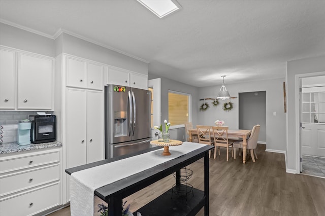 4690 Red Leaf Way, Augusta, GA 30907 - kitchen with stainless steel fridge with ice dispenser, white cabinets, baseboards, dark wood finished floors, and crown molding