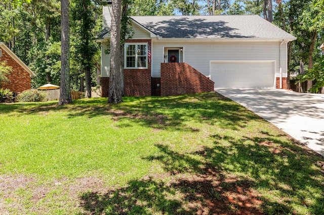 4690 Red Leaf Way, Augusta, GA 30907 - view of front of house featuring a chimney, concrete driveway, an attached garage, and brick siding