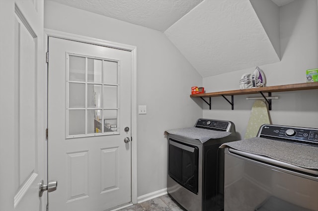 4690 Red Leaf Way, Augusta, GA 30907 - laundry room featuring washer and clothes dryer, a textured ceiling, and baseboards
