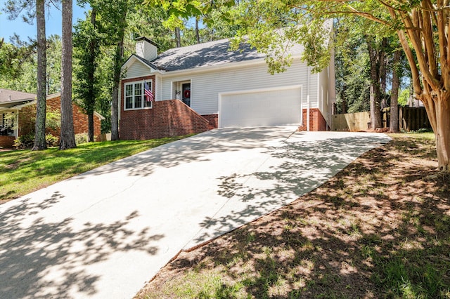 4690 Red Leaf Way, Augusta, GA 30907 - view of front facade with brick siding, a chimney, driveway, and an attached garage