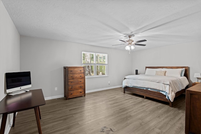 4690 Red Leaf Way, Augusta, GA 30907 - bedroom with wood finished floors, baseboards, a textured ceiling, and ceiling fan