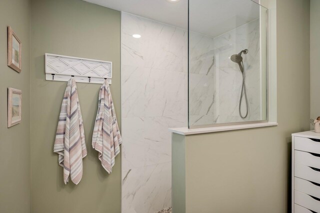 bathroom with a tile shower