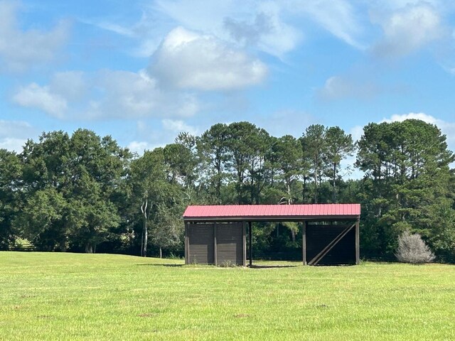 view of outdoor structure with a lawn