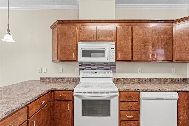 kitchen featuring white appliances, hanging light fixtures, and ornamental molding