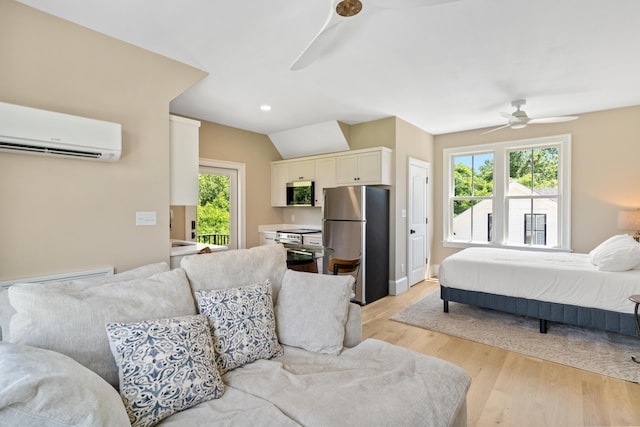 636 Railroad Ave, North Augusta, SC 29841 - bedroom with freestanding refrigerator, a wall unit AC, light wood-style flooring, access to exterior, and a ceiling fan
