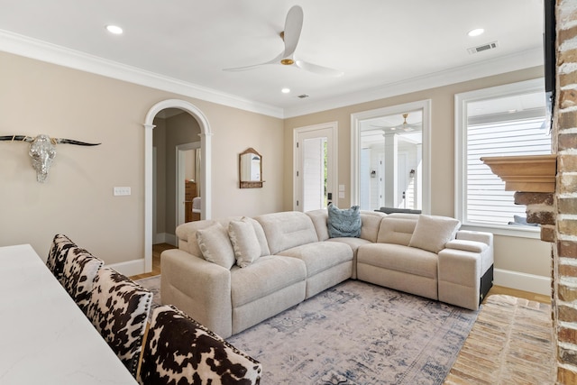 636 Railroad Ave, North Augusta, SC 29841 - living area featuring a ceiling fan, arched walkways, baseboards, ornamental molding, and light wood-style floors