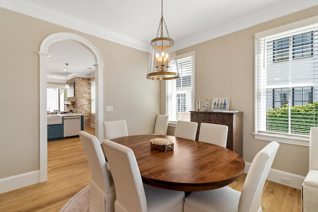 636 Railroad Ave, North Augusta, SC 29841 - dining area featuring crown molding, healthy amount of natural light, light wood-style flooring, and baseboards
