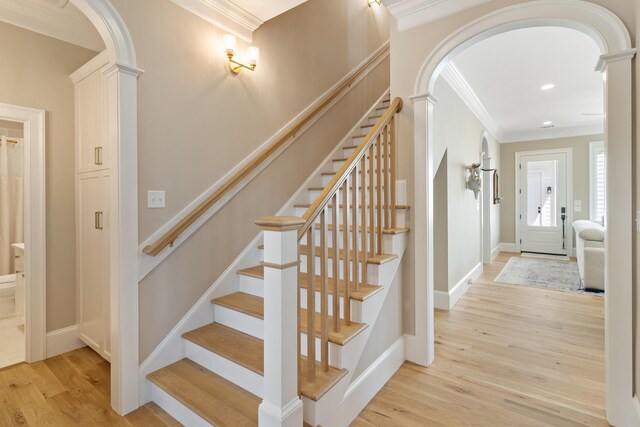 636 Railroad Ave, North Augusta, SC 29841 - stairway featuring arched walkways, ornamental molding, decorative columns, wood finished floors, and recessed lighting