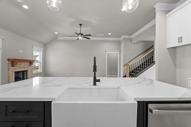 856 Whitney Shoals Rd, Evans, GA 30809 - kitchen featuring dishwasher, a sink, open floor plan, ceiling fan, and a brick fireplace