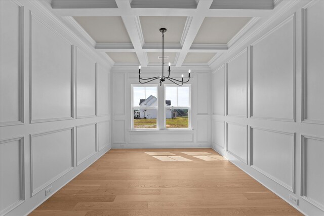 856 Whitney Shoals Rd, Evans, GA 30809 - unfurnished dining area with a decorative wall, a chandelier, light wood-type flooring, beamed ceiling, and coffered ceiling