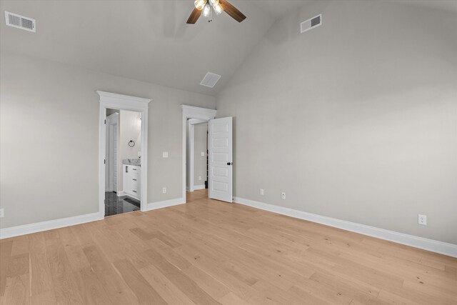 856 Whitney Shoals Rd, Evans, GA 30809 - unfurnished bedroom featuring light wood-style flooring, baseboards, high vaulted ceiling, ensuite bathroom, and ceiling fan