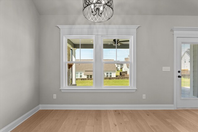 856 Whitney Shoals Rd, Evans, GA 30809 - entryway featuring a chandelier, light wood-style flooring, and plenty of natural light