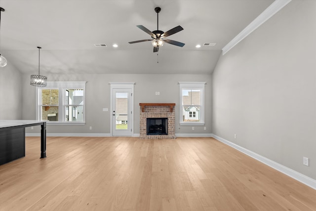 856 Whitney Shoals Rd, Evans, GA 30809 - unfurnished living room with vaulted ceiling, plenty of natural light, ceiling fan, a fireplace, and baseboards