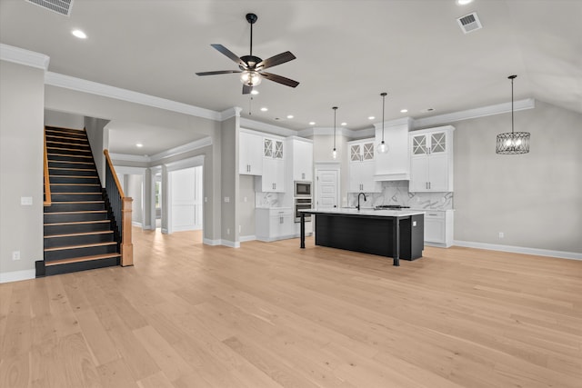856 Whitney Shoals Rd, Evans, GA 30809 - kitchen with appliances with stainless steel finishes, a breakfast bar area, baseboards, backsplash, and recessed lighting