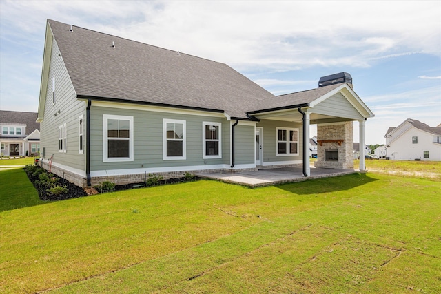 856 Whitney Shoals Rd, Evans, GA 30809 - rear view of house featuring exterior fireplace, a patio area, a lawn, a chimney, and a shingled roof