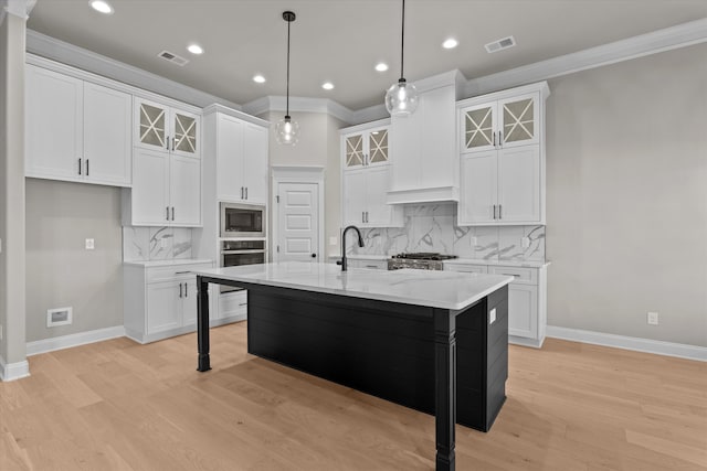 856 Whitney Shoals Rd, Evans, GA 30809 - kitchen featuring ornamental molding, built in microwave, baseboards, white cabinetry, and light wood-style flooring