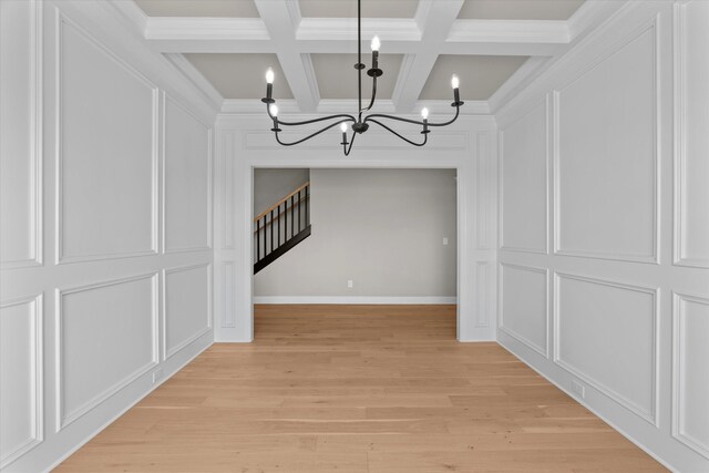 856 Whitney Shoals Rd, Evans, GA 30809 - unfurnished dining area with a chandelier, a decorative wall, beam ceiling, coffered ceiling, and stairs