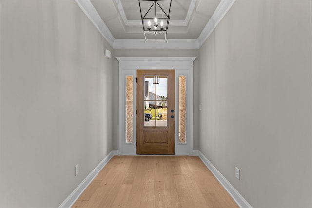 856 Whitney Shoals Rd, Evans, GA 30809 - entryway featuring light wood finished floors, a chandelier, crown molding, baseboards, and a raised ceiling