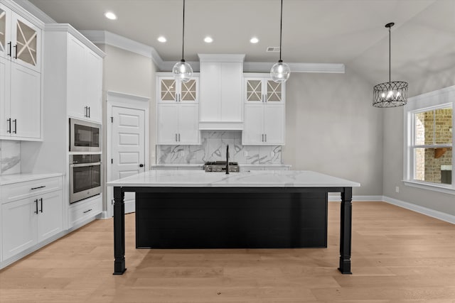 856 Whitney Shoals Rd, Evans, GA 30809 - kitchen with stainless steel oven, a breakfast bar, backsplash, built in microwave, and white cabinets