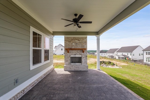 856 Whitney Shoals Rd, Evans, GA 30809 - view of patio / terrace with an outdoor brick fireplace, a ceiling fan, and a residential view