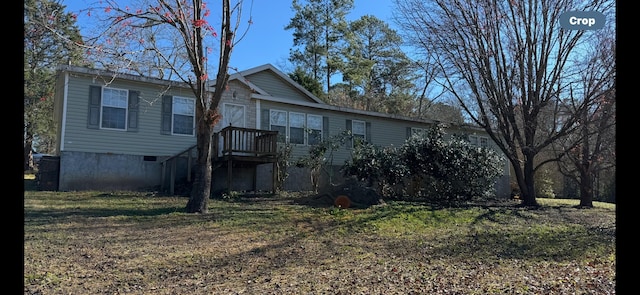 rear view of property with a lawn