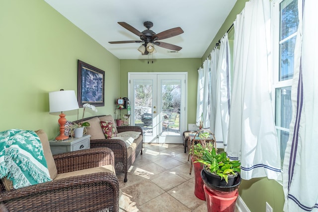 sunroom / solarium featuring ceiling fan, french doors, and visible vents