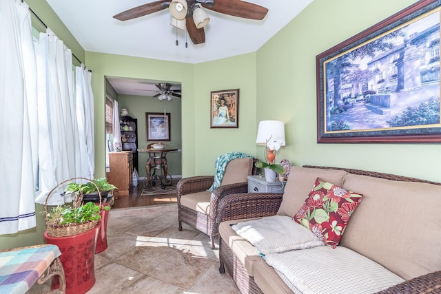 living area featuring ceiling fan