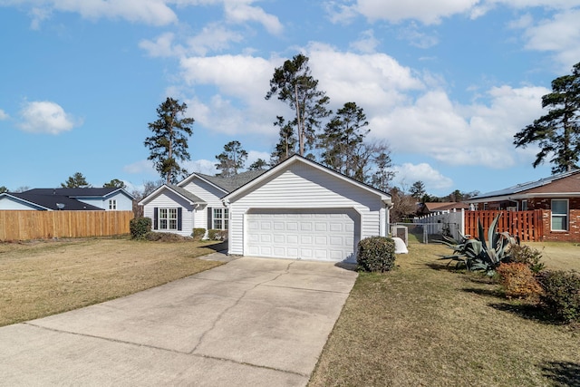 ranch-style home featuring driveway, an attached garage, fence, and a front yard