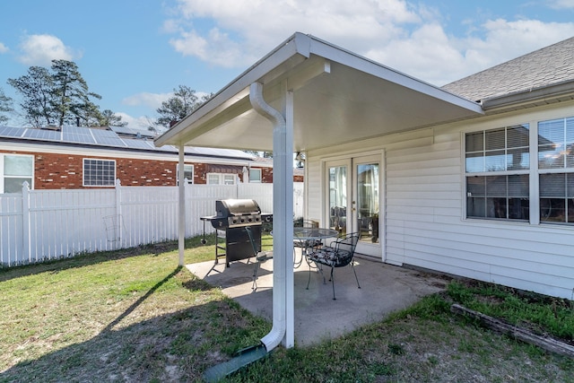 view of patio / terrace featuring fence, grilling area, and french doors