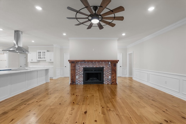 473 Sugarcreek Dr, Grovetown, GA 30813 - unfurnished living room featuring a decorative wall, ceiling fan, ornamental molding, recessed lighting, and light wood finished floors