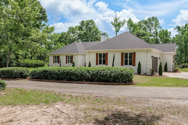473 Sugarcreek Dr, Grovetown, GA 30813 - view of front of property featuring a garage, driveway, a chimney, brick siding, and a shingled roof