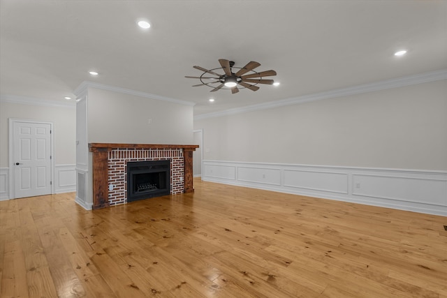 473 Sugarcreek Dr, Grovetown, GA 30813 - unfurnished living room featuring a ceiling fan, a decorative wall, crown molding, recessed lighting, and a brick fireplace