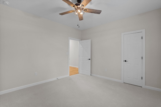 473 Sugarcreek Dr, Grovetown, GA 30813 - unfurnished bedroom with light colored carpet, baseboards, and a ceiling fan