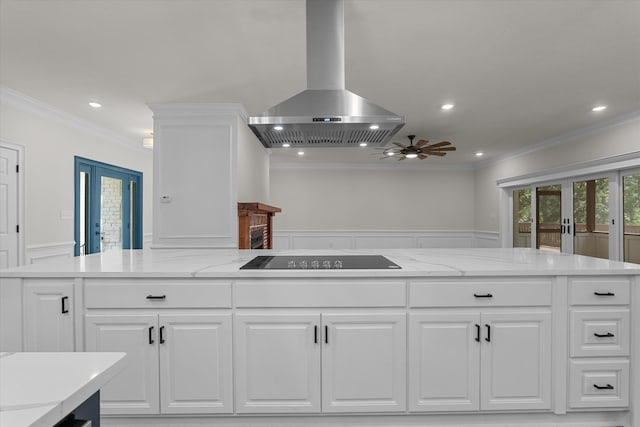 473 Sugarcreek Dr, Grovetown, GA 30813 - kitchen with french doors, island exhaust hood, black electric stovetop, ornamental molding, and ceiling fan
