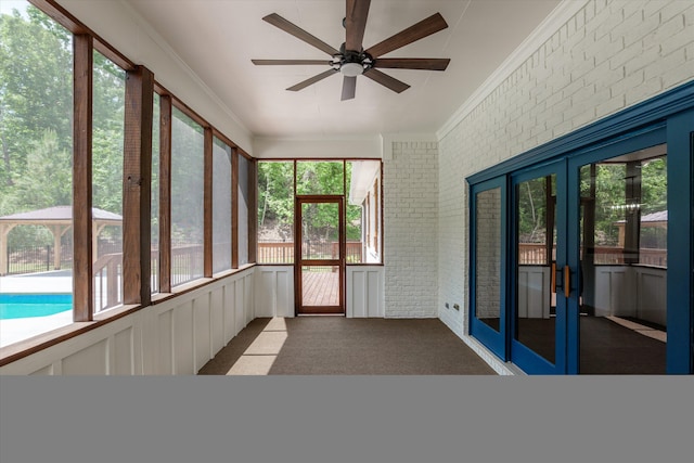 473 Sugarcreek Dr, Grovetown, GA 30813 - unfurnished sunroom with french doors, brick wall, crown molding, a ceiling fan, and carpet floors